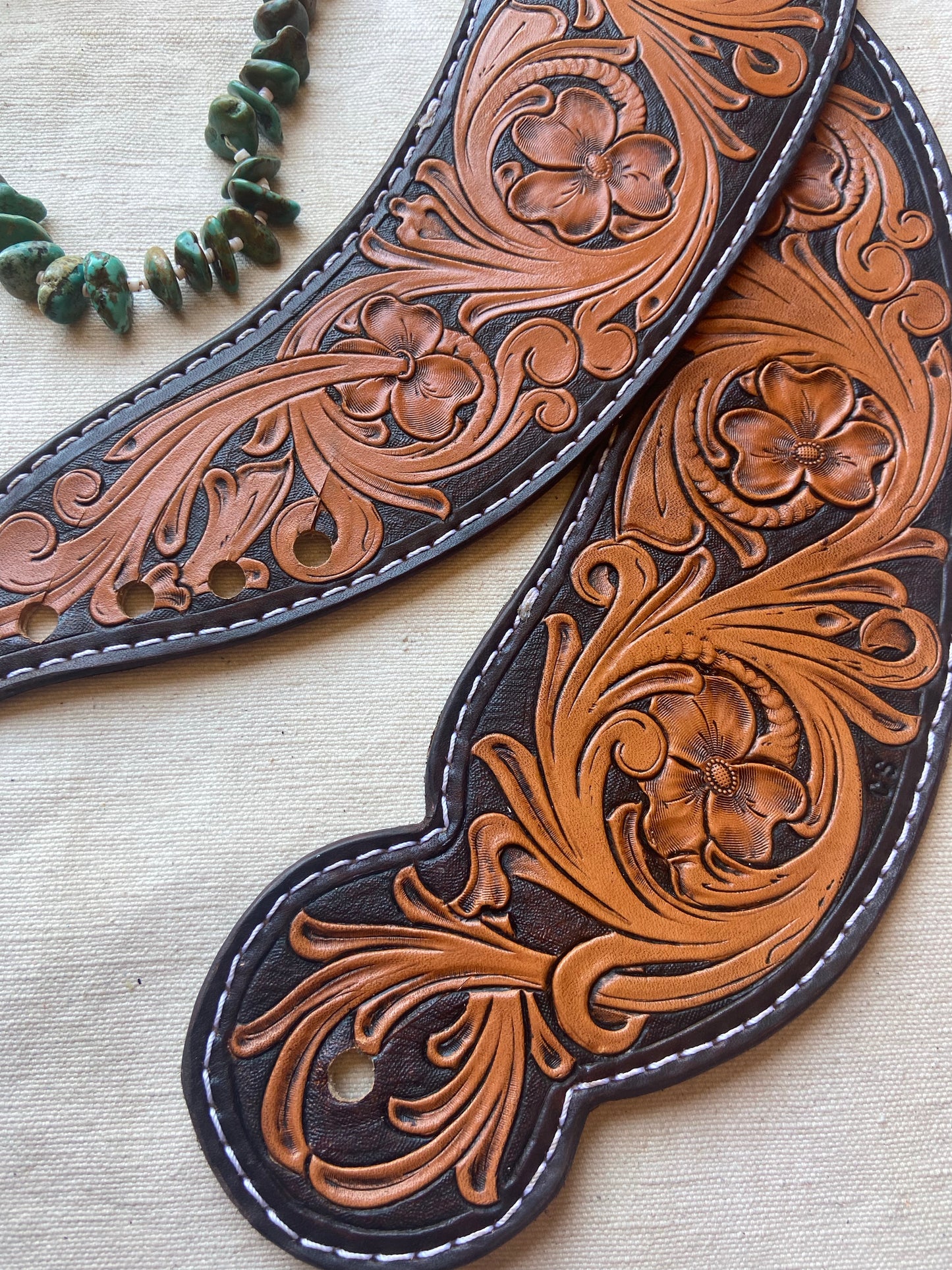 Floral Tooled Dove Wing Spur Straps